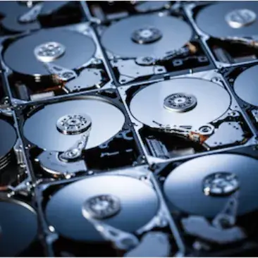 Hard disk drives opened to show the platters